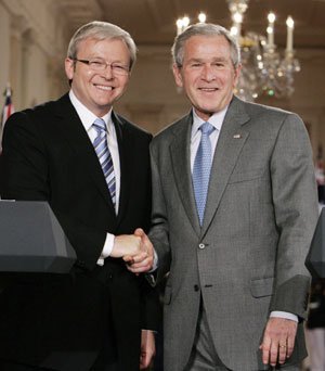 U.S. President George W. Bush (R) and Australian Prime Minister Kevin Rudd shakes hands after holding a joint news conference in the East Room of the White House in Washington March 28, 2008. 
