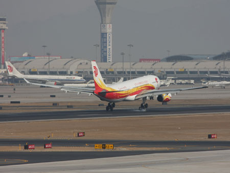 The plane carrying the Beijing Olympic flame touches downs at the Beijing Capital International Airport, in Beijing, China on March 31, 2008. 