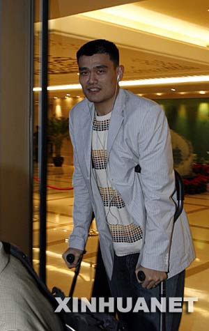 NBA All-Star Yao Ming arrives at Beijing Capital International Airport Thursday night, April 3, 2008. The Houston Rockets center who is sidelined because of a season-ending foot injury, will undergo tests by Chinese medical experts. Yao recently started training on his upper body but his left foot is still swollen after a stress fracture.