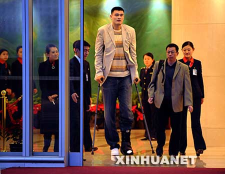 NBA All-Star Yao Ming arrives at Beijing Capital International Airport Thursday night, April 3, 2008. The Houston Rockets center who is sidelined because of a season-ending foot injury, will undergo tests by Chinese medical experts. Yao recently started training on his upper body but his left foot is still swollen after a stress fracture.