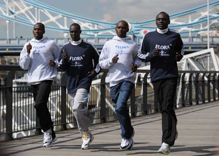 Elite Kenyan marathon runners (L-R) Martin Lel, Luke Kibet, Sammy Wanjiru and Felix Limo pose for photographers in front of Tower Bridge in London April 9, 2008, 2008. The annual London Marathon takes place on April 13. 