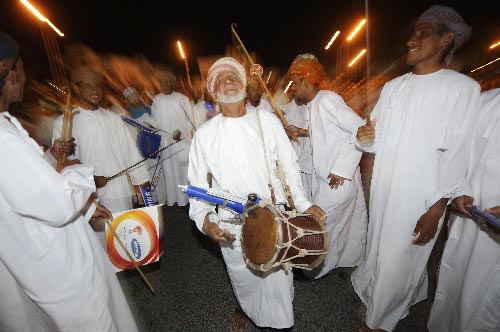 Photo: People celebrate the Olympic torch relay