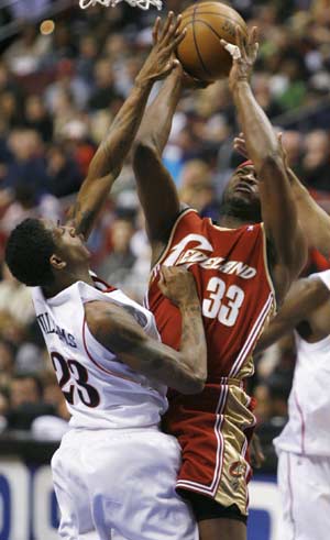 Philadelphia 76ers guard Louis Williams (23) blocks a shot by the Cleveland Cavaliers guard Devin Brown (33) during second quarter NBA basketball action in Philadelphia, Pennsylvania, April 14, 2008. 