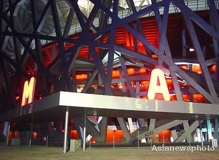 The National Stadium of China, also known as the Bird's Nest and the main venue holding the opening ceremony of the 2008 Olympics, conducts lighting tests in Beijing, April 13, 2008. 