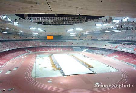 The National Stadium of China, also known as the Bird's Nest and the main venue holding the opening ceremony of the 2008 Olympics, conducts lighting tests in Beijing, April 13, 2008. 
