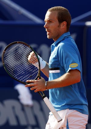 Olivier Rochus of Belgium reacts to winning a point against Roger Federer of Switzerland during their tennis match at the Estoril Open in Lisbon April 15, 2008.