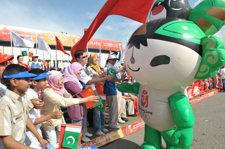 One of the mascots of the 2008 Beijing Olympic Games greets the spectators at the lighting ceremony of the Olympic torch relay at the Pakistan Sports Complex in Islamabad, capital of Pakistan, on April 16, 2008. 