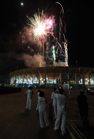 Fireworks explode over the Pakistan Sports Complex during the 2008 Beijing Olympic Games torch relay in Islamabad, capital of Pakistan, on April 16, 2008.