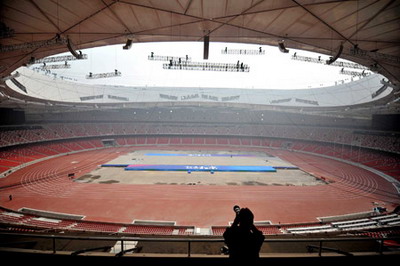 A photographer takes picture of the National Stadium, known as the &apos;Bird&apos;s Nest&apos;, in Beijing, capital of China, Aprial 16, 2008.