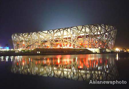 The National Stadium of China, also known as the Bird's Nest and the main venue holding the opening ceremony of the 2008 Olympics, conducts lighting tests in Beijing, April 13, 2008.