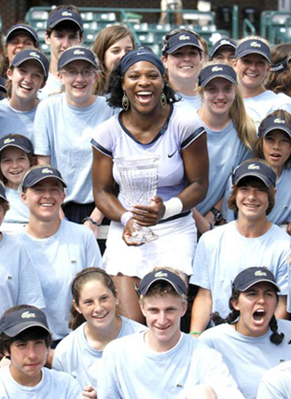 Serena Williams of the United States poses with the ball boys and girls after her 6-4, 3-6, 6-3 victory over Vera Zvonareva of Russia in the finals of the Family Circle Cup in Charleston on Sunday. 