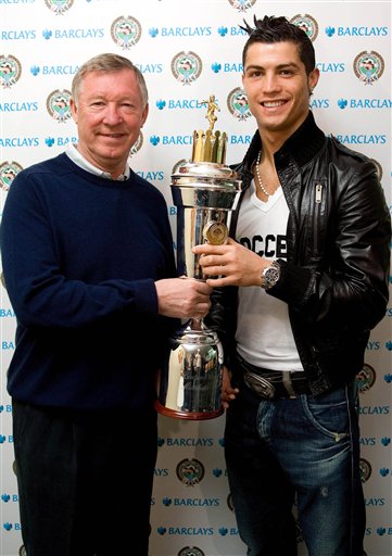 Britain's Professional Footballers Association, PFA, Player's Player of the Year award winner Cristiano Ronaldo of Manchester United and Portugal poses with his trophy in Manchester, England, yesterday after accepting it from his manager Sir Alex Ferguson.
