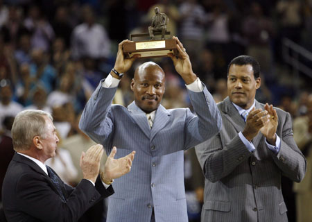 New Orleans Hornets head coach Byron Scott holds up the Coach of the Year Trophy before his team took the court against the Dallas Mavericks for Game 5 of their NBA playoff series in New Orleans, Louisiana April 29, 2008.