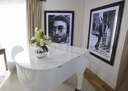  A portrait of Beatles John Lennon hangs on the wall in the Lennon suite at the newly opened Hard Days Night Hotel in Liverpool, northern England, February 1, 2008.  