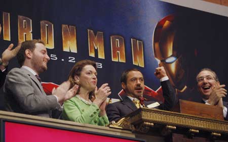 Actor Robert Downey Jr. (2nd R) rings the opening bell at the New York Stock Exchange, April 29, 2008. U.S. stocks trimmed losses and were little changed on Tuesday after a report showed a stronger-than-expected reading of consumer confidence for April. Downey is the star of the new Marvel Comics movie 'Iron Man' opening May 2.