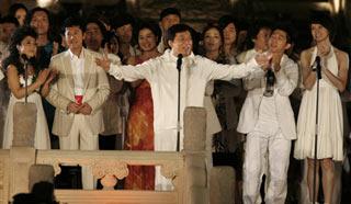 Action star Jackie Chan (C) performs with other celebrities during the 4th Music Award of the Games of the XXIX Olympiad at the Worker People's Cultural Palace as part of the 100-day Olympic countdown celebration in Beijing April 30, 2008. [Agencies]
