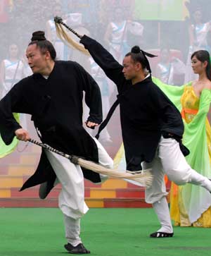 Taoists from Wudang Wushu Troupe of Mount Wudang perform during the Chinese Wushu Festival, a rendezvous of leading Chinese martial arts factions as Shaolin, Wudang and Emei, in a folk culture village in Shenzhen, south China's Guangdong Province, April 29, 2008.