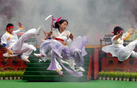 Members of Sichuan Emei Centennial Wushu Troupe perform with swords during the Chinese Wushu Festival, a rendezvous of leading Chinese martial arts factions as Shaolin, Wudang and Emei, in a folk culture village in Shenzhen, south China&apos;s Guangdong Province, April 29, 2008. 