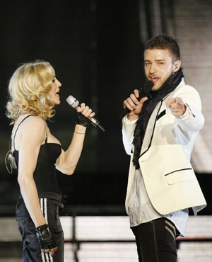 Singer Madonna performs with Justin Timberlake during a concert to celebrate the launch of her new album 