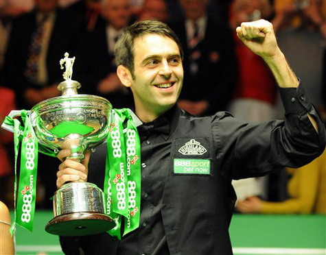 Ronnie O'Sullivan celebrates after winning the final of the World Snooker Championship at the Crucible Theatre, Sheffield, England yesterday. The fast-scoring Englishman won his third world snooker title, beating Ali Carter 18-8 in the final on Monday.