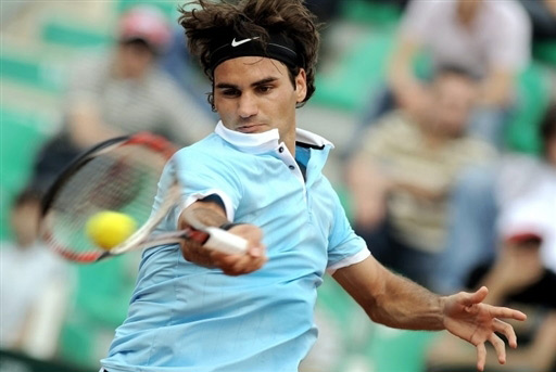 Roger Federer returns a shot during his game against Guillermo Canas in the second round of the Rome Masters. Federer won the game 6-3, 6-3.
