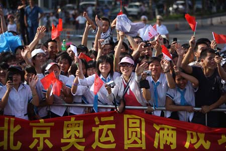 People cheer for the 2008 Beijing Olympic Games torch relay in Haikou, south China's Hainan Province, on May 6, 2008. 