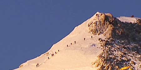 TV grab from May 8, 2008 shows the Chinese climbers spurt to the top of Mt. Qomolangma, at about the altitude of 8,800 meters in southwest China's Tibet Autonomous Region. Chinese climbers carrying the Olympic flame will reach the top of Mt. Qomolangma Thursday morning.