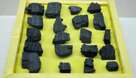 Photo taken on May 6, 2008 shows fragments of wooden block for printing unearthed from a tomb, at the Western Xia Museum near the Imperial Tombs of the Western Xia Kingdom (1038-1227) in Yinchuan, capital of northwest China