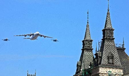 Russian military planes fly above the Historical Museum in Red Square during a Victory Day military parade in Moscow May 9, 2008. Warplanes screamed over Red Square and missile launchers rumbled past ranks of soldiers on Friday when Russia celebrated victory over Nazi Germany with a show of military might not seen since the collapse of the Soviet Union.
