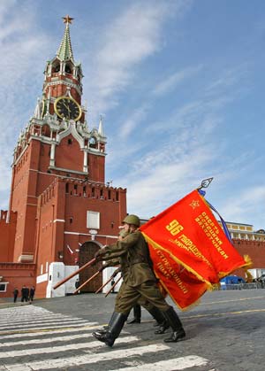Soldiers march carrying flags displaying portraits of the Soviet state founder, Vladimir Lenin, during the Victory Day military parade at Red Square in Moscow May 9, 2008. Warplanes screamed over Red Square and missile launchers rumbled past ranks of soldiers on Friday when Russia celebrated victory over Nazi Germany with a show of military might not seen since the collapse of the Soviet Union.