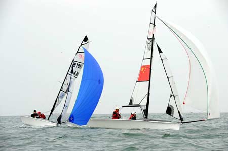 Sailboats compete during the SKUD18 competition at the 2008 International Association for Disabled Sailing (IFDS) Qingdao International Regatta in Qingdao, east China's Shandong Province, May 11, 2008.(