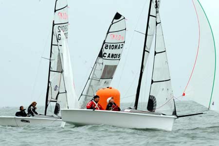 Sailors compete during the SKUD18 competition at the 2008 International Association for Disabled Sailing (IFDS) Qingdao International Regatta in Qingdao, east China's Shandong Province, May 11, 2008. 