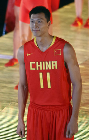 Yi Jianlian poses with new Olympic outfits at the Taimiao, or Imperial Ancestral Temple, inside the Forbidden City on May 12, 2008.
