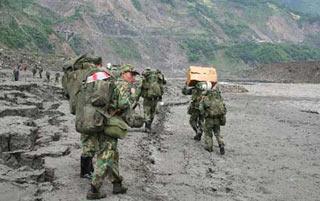 The Chinese People's Liberation Army (PLA) Monday Wednesday arrive at Yingxiu Town of Wenchuan County, the epicenter of Monday's earthquake that jolted southwest China's Sichuan Province. (Xinhua Photo)