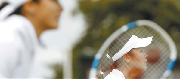 Yan Zi (left) and Peng Shuai, both heading to the French Open with their Chinese teammates, expect that a strong performance at Roland Garros will help them secure Olympic tickets to August's Beijing Games. Reuters