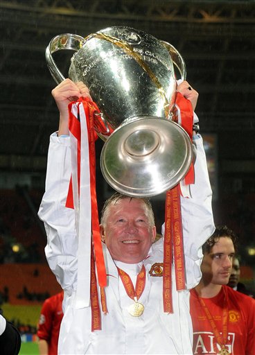 Manchester United soccer manager Sir Alex Ferguson holds the trophy aloft after his team won the UEFA Champions League Final against Chelsea at the Luzhniki Stadium in Moscow, Russia, early today. Manchester United won the Champions League final after a penalty shoot-out.
