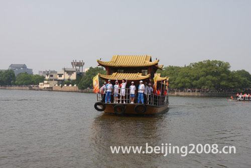 Photo: The Olympic torch takes boat ride in Jiaxing