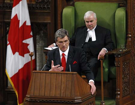 Ukraine's President Viktor Yushchenko (L) addresses a joint session of Parliament at the House of Commons as speaker Peter Millike looks on in Ottawa May 26, 2008. Yushchenko is on a state visit to Canada until May 28.(Xinhua/Reuters Photo)