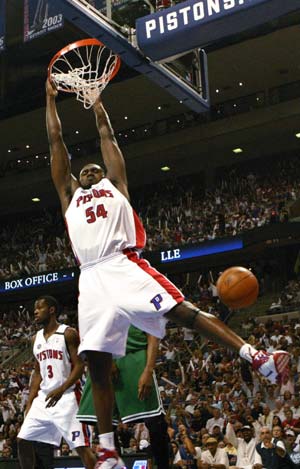 Detroit Pistons Jason Maxiell hangs on the rim after dunking the ball in the second quarter of play against the Boston Celtics during Game 4 of the NBA Eastern Conference Finals in Auburn Hills, Michigan May 26, 2008. 