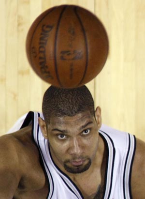 San Antonio Spurs Tim Duncan keep his eyes on the ball as he look to rebound against the Los Angeles Lakers during Game 4 of their NBA Western Conference final basketball playoff series in San Antonio, Texas, May 27, 2008.