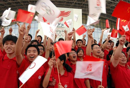 Photo: Locals celebrate the Beijing Olympic torch relay in Huainan