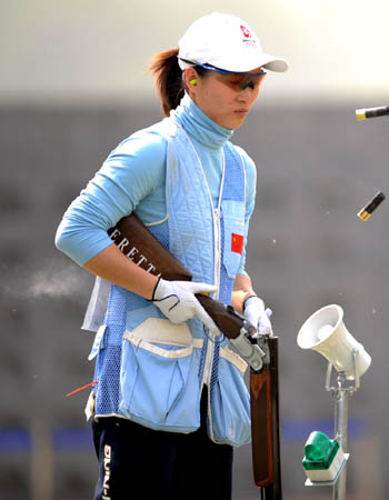 China's Wei Ning unloads bullets during the women's skeet final in the 'Good Luck Beijing' 2008 ISSF World Cup at the Beijing Shooting Range CTF in Beijing, April 17, 2008. Wei Ning won the gold of the event with a score of 97 points. (Xinhua Photo)