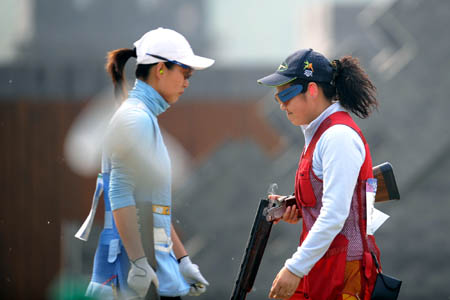 China's Wei Ning (L) and Zhang Shan compete during the women's skeet final in the 'Good Luck Beijing' 2008 ISSF World Cup at the Beijing Shooting Range CTF in Beijing, April 17, 2008. Wei Ning won the gold of the event with a score of 97 points. 