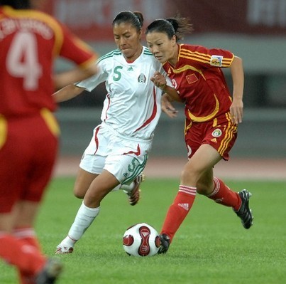 Chinese women's soccer team competes with their German counterparts during the Good Luck Beijing International Women's Football Tournament in Shenyang Olympic Stadium.