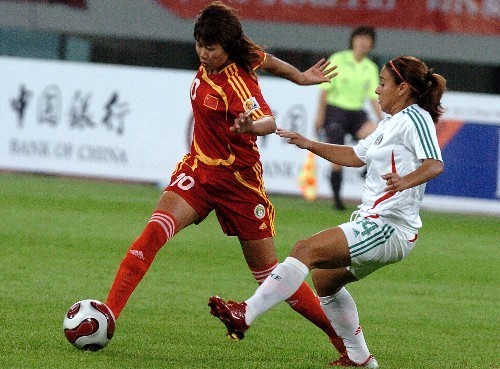 Chinese women's soccer team competes with their German counterparts during the Good Luck Beijing International Women's Football Tournament in Shenyang Olympic Stadium.