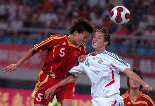 Chinese women's soccer team competes with their German counterparts during the Good Luck Beijing International Women's Football Tournament in Shenyang Olympic Stadium.