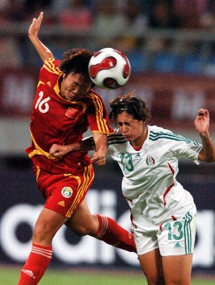 Chinese women's soccer team competes with their German counterparts during the Good Luck Beijing International Women's Football Tournament in Shenyang Olympic Stadium.