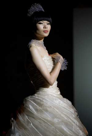 International super model China's Lu Yan displays wedding dress and jewellery designes in Hong Kong, South China, May 29, 2008.