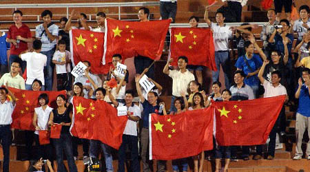 Football funs of China applause for the game. Defending champions China and former winner Democratic People's Republic of Korea (DPRK) secured berths to semi-finals of the final round of the 2008 Women's Asian Football Championship after beating Thailand 5-1, and hosts Vietnam 3-0, respectively, in Vietnam's southern Ho Chi Minh City on Friday.