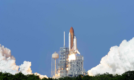 U.S. space shuttle Discovery soared into space at 5:02 p.m. EDT (2102 GMT) on Saturday as scheduled from its seaside launch pad at Kennedy Space Center in Florida.